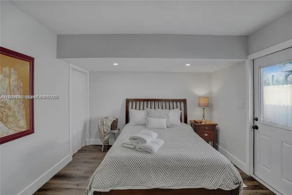 a bedroom with a large bed and a closet