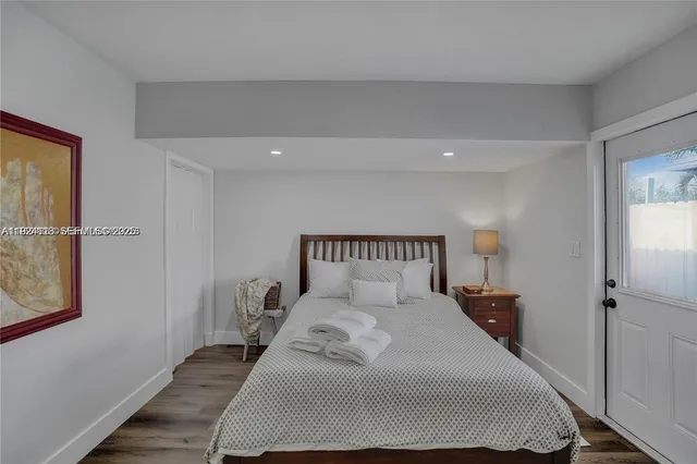 a bedroom with a large bed and a closet