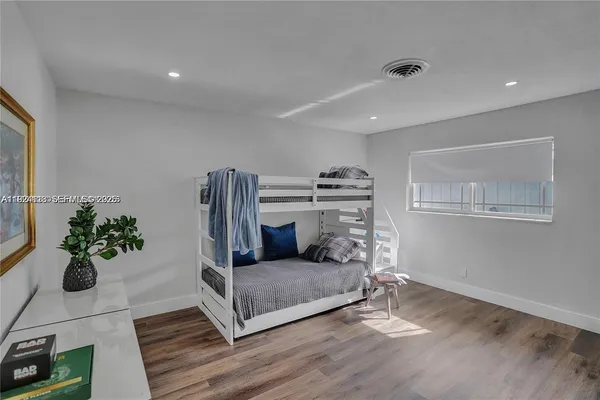 a living room with furniture and flowers