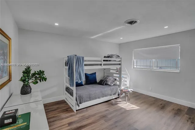 a living room with furniture and flowers
