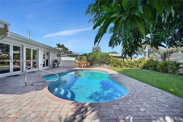 a view of a swimming pool with a patio