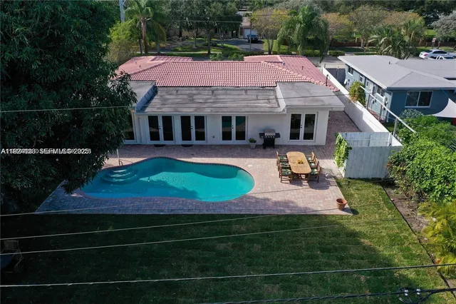 a view of house with outdoor space and sitting area