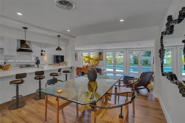 a view of a dining room with furniture window and outside view