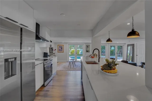 a view of a kitchen with a large window