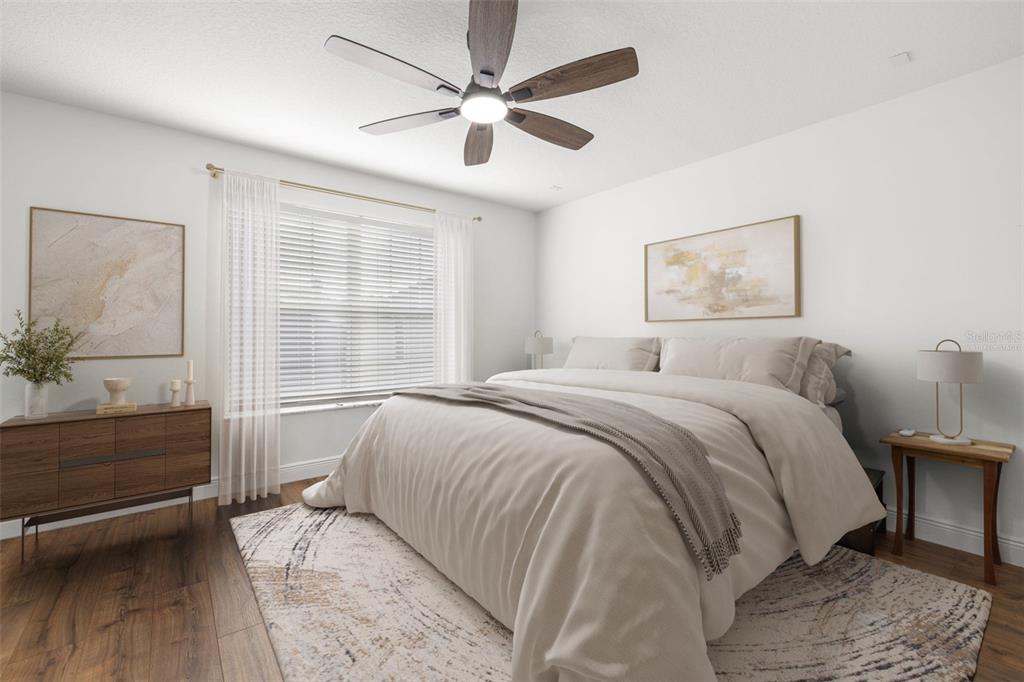 5950 Beaconpark Street Lithia, FL 33547 - Photo 20 of 56 a bedroom with a bed and a chandelier