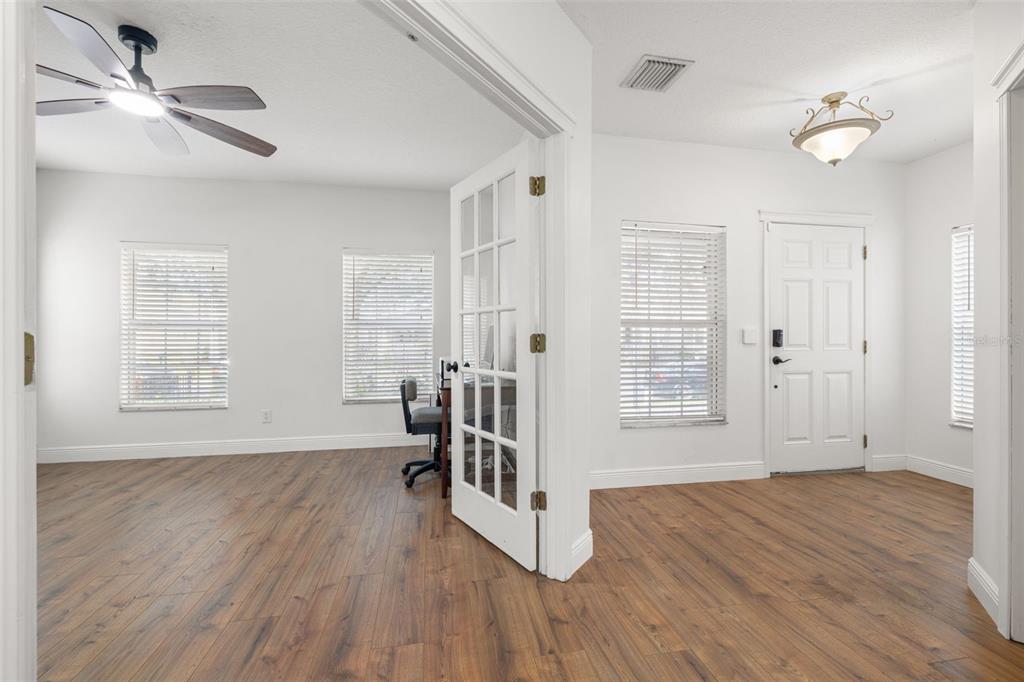5950 Beaconpark Street Lithia, FL 33547 - Photo 3 of 56 an empty room with wooden floor and windows