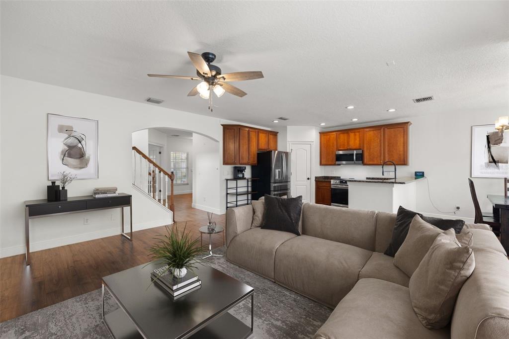 5950 Beaconpark Street Lithia, FL 33547 - Photo 8 of 56 a living room with furniture and a view of kitchen