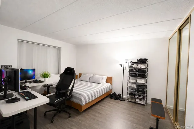 a bedroom with a workspace