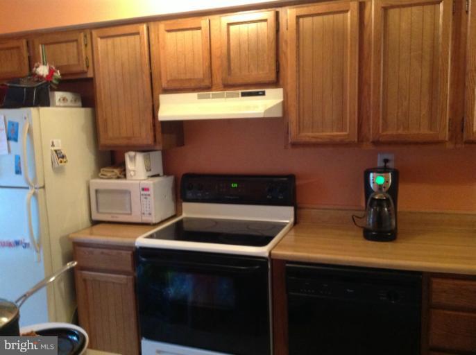 2917 Hickory Leaf Way Silver Spring, MD 20904 - Photo 2 of 8 a kitchen with a sink and cabinets