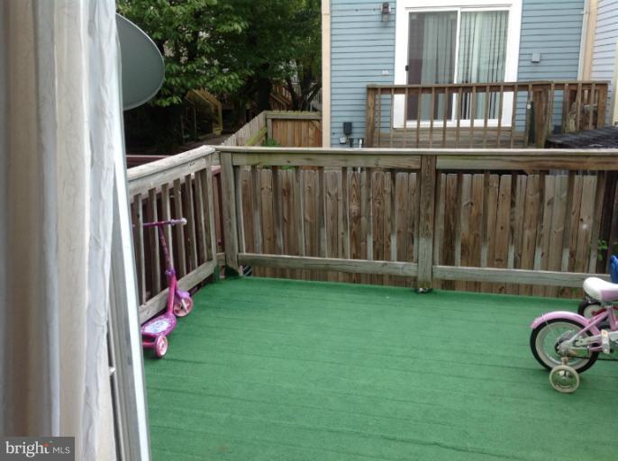2917 Hickory Leaf Way Silver Spring, MD 20904 - Photo 5 of 8 a view of a backyard with wooden fence