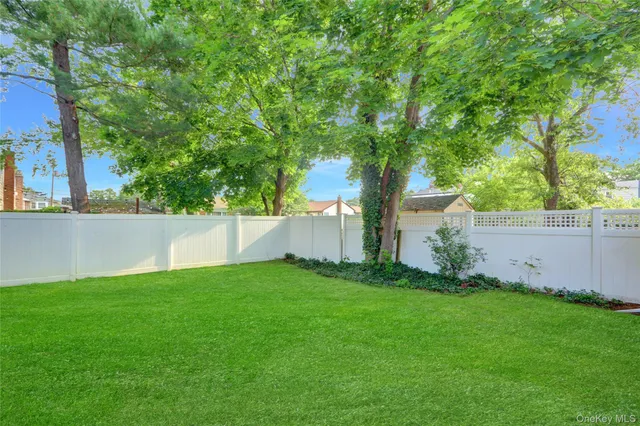 a view of backyard with green space