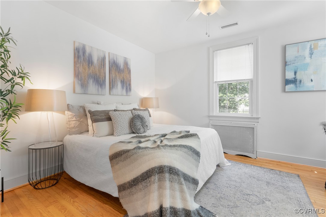 1712 Seddon Road Richmond, VA 23227 - Photo 13 of 29 Bedroom featuring radiator heating unit, wood fini