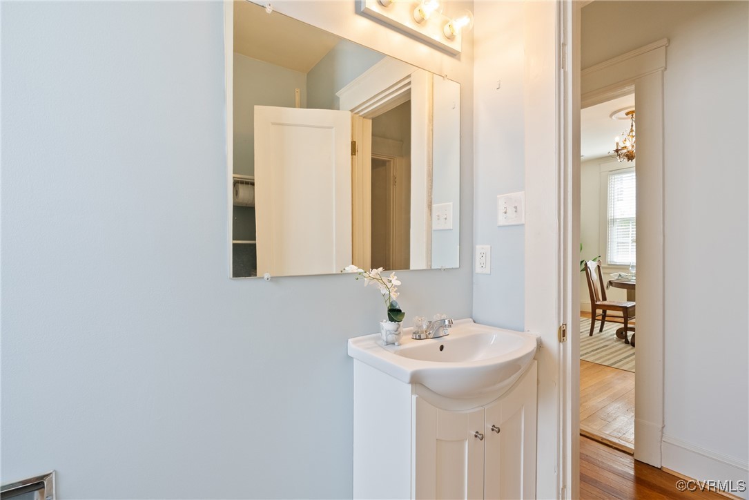 1712 Seddon Road Richmond, VA 23227 - Photo 18 of 29 Bathroom with wood finished floors, vanity, and ba