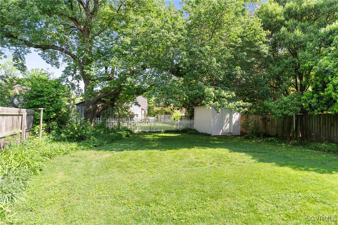 1712 Seddon Road Richmond, VA 23227 - Photo 24 of 29 View of yard with a storage shed and an outdoor st