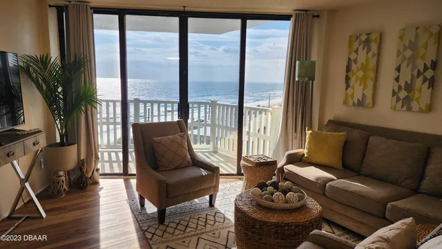 a living room with furniture and a large window