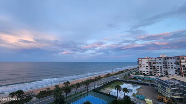 a view of a city and ocean