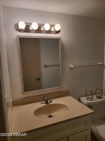 a bathroom with a sink and mirror