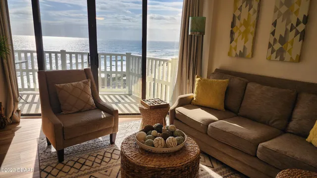 a living room with furniture and a large window
