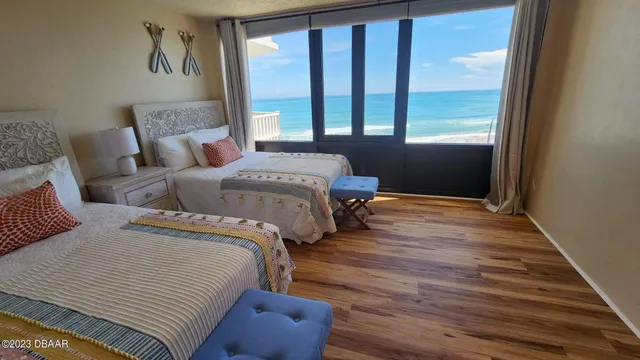 a bedroom with double bed and a window