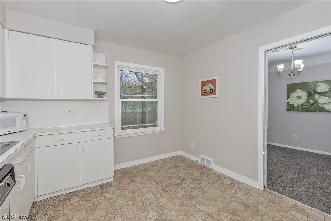 4402 Bayard Road South Euclid, OH 44121 - Photo 12 of 27 Spacious kitchen with
white cabinetry and all
appliances