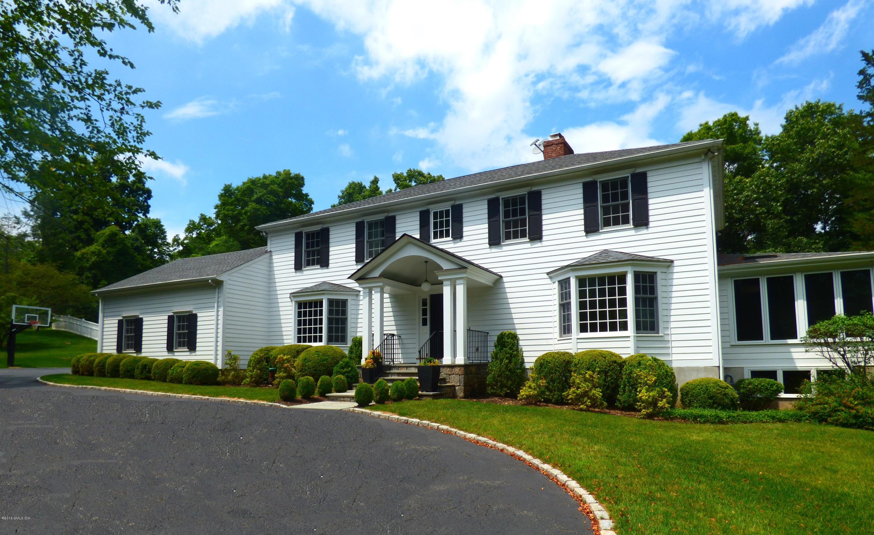 111 Dingletown Road Greenwich, CT 06830 - Photo 1 of 44 a front view of a house with a yard