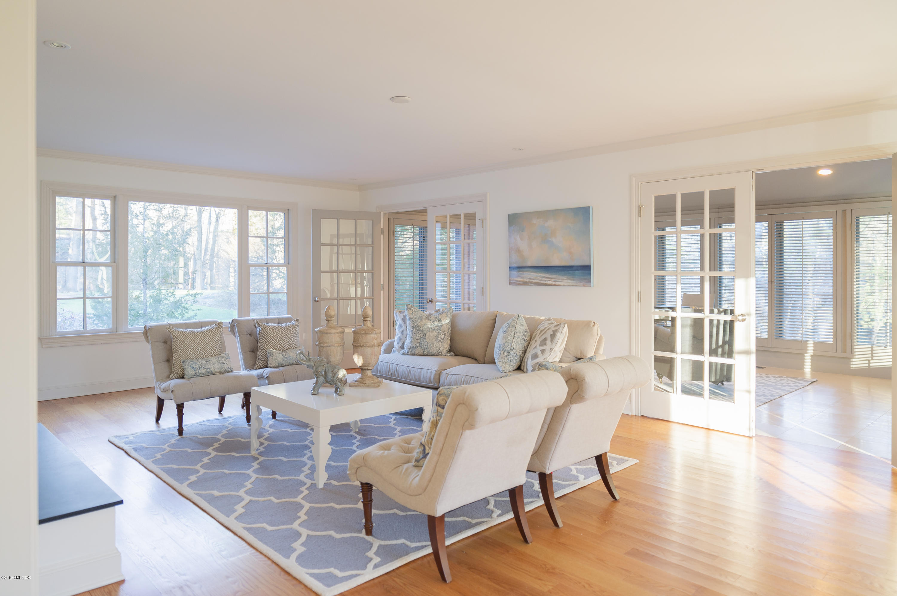 111 Dingletown Road Greenwich, CT 06830 - Photo 11 of 44 a living room with furniture and wooden floor