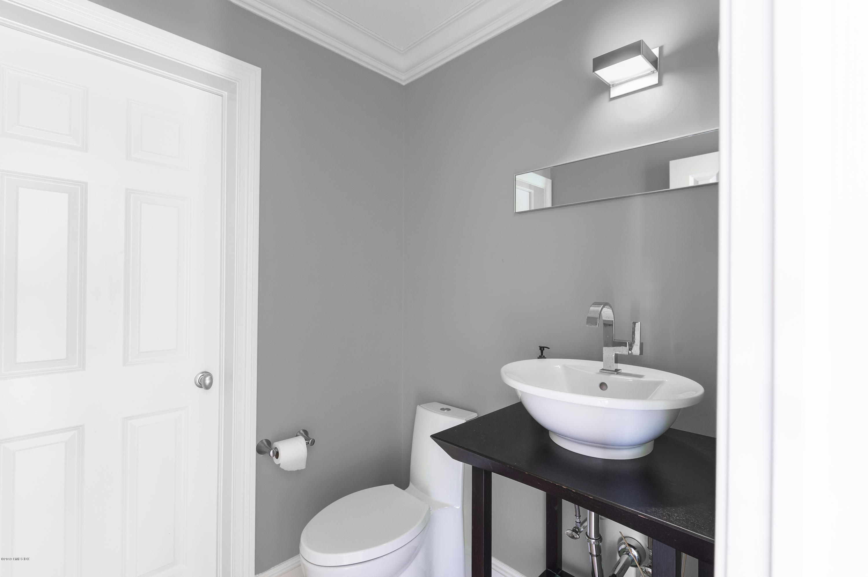 111 Dingletown Road Greenwich, CT 06830 - Photo 19 of 44 a bathroom with a sink and a toilet