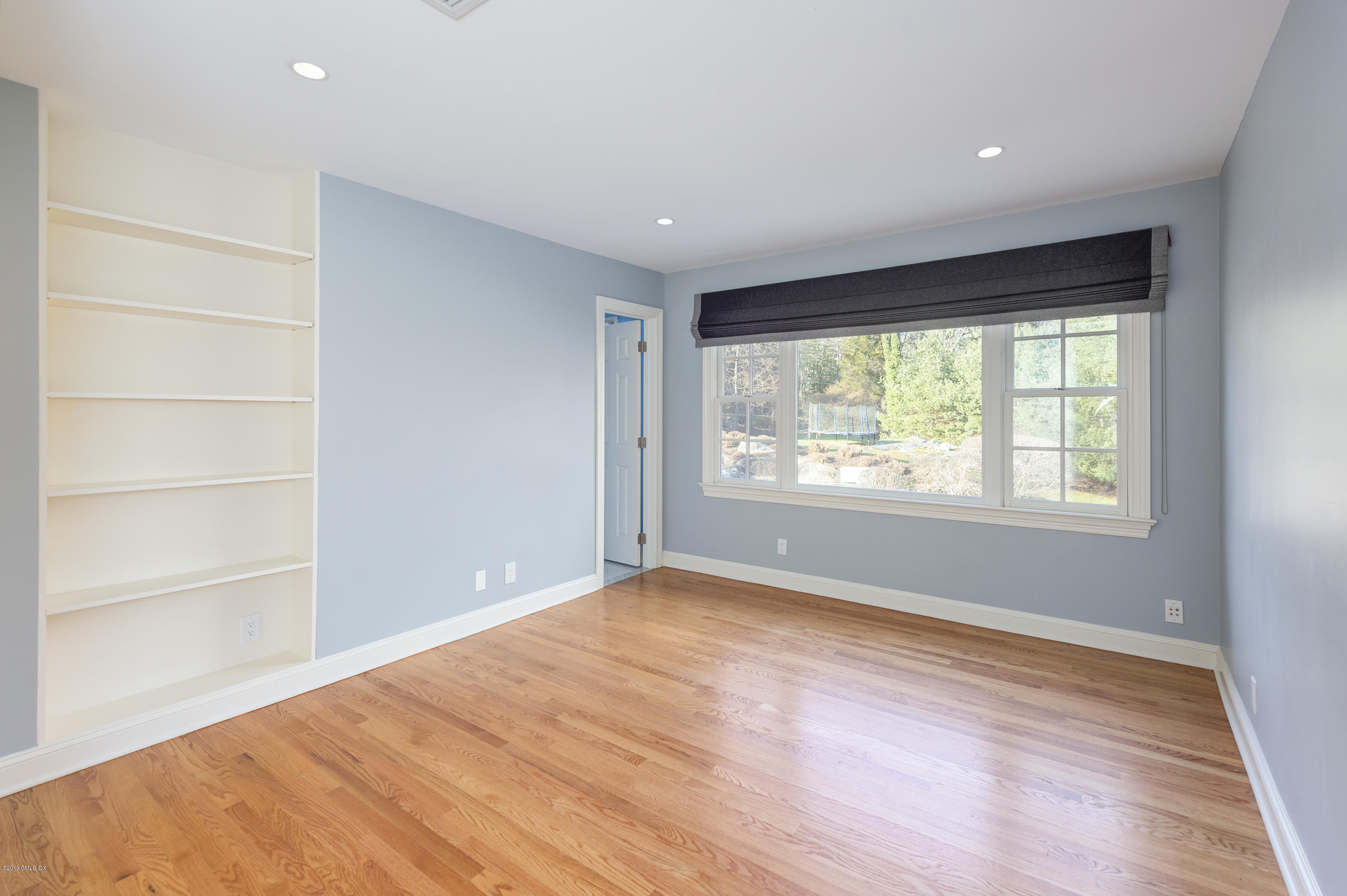 111 Dingletown Road Greenwich, CT 06830 - Photo 25 of 44 a view of an empty room with a window