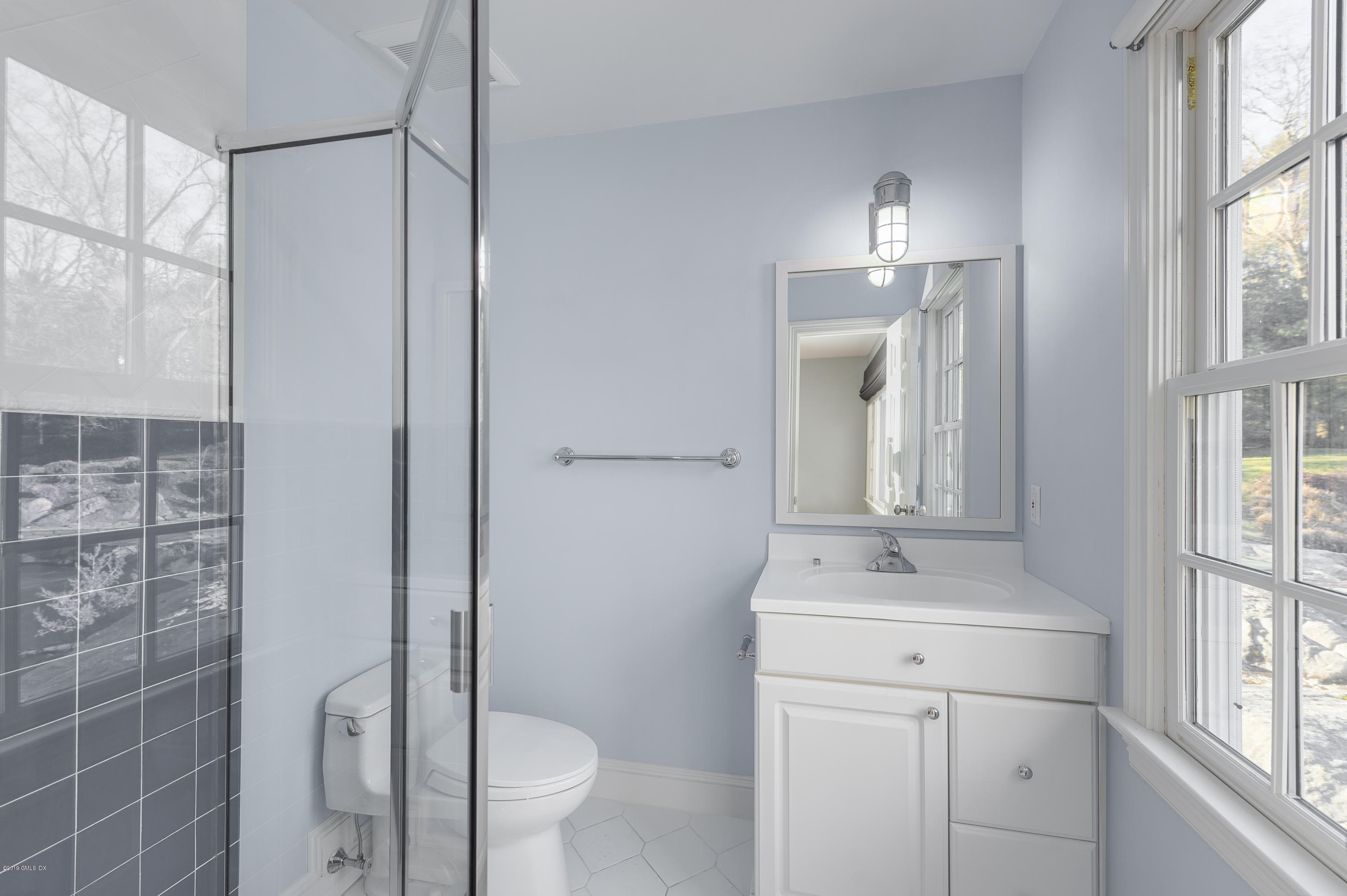 111 Dingletown Road Greenwich, CT 06830 - Photo 26 of 44 a bathroom with a sink a toilet and shower