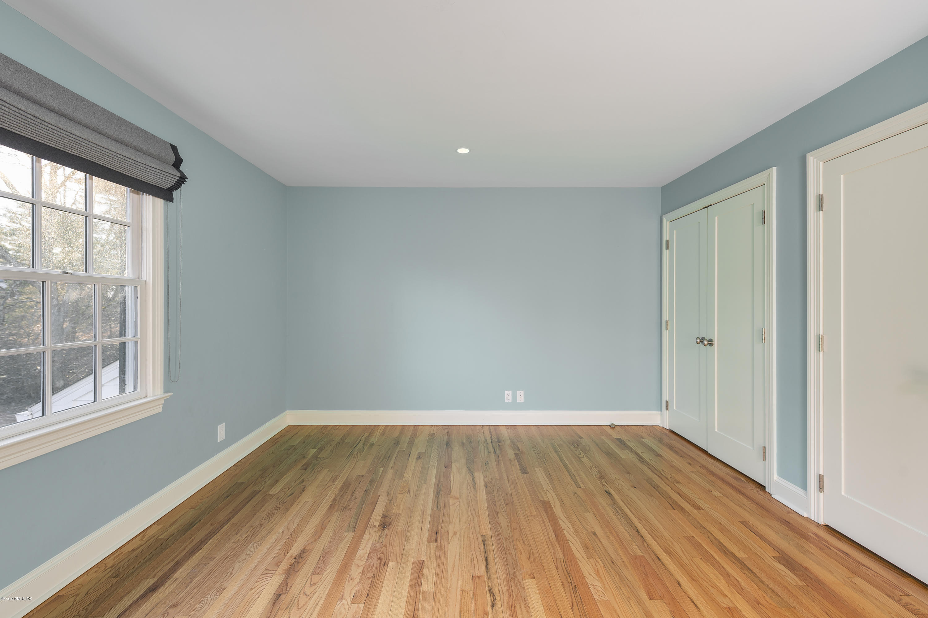 111 Dingletown Road Greenwich, CT 06830 - Photo 27 of 44 a view of a room with wooden floor and windows