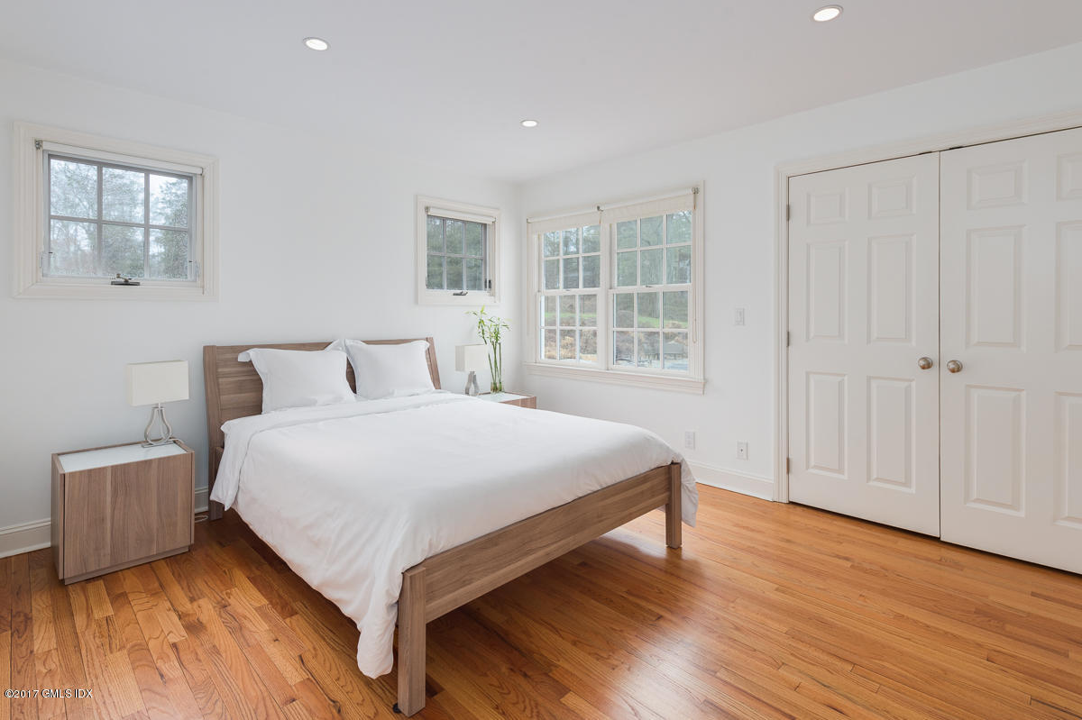 111 Dingletown Road Greenwich, CT 06830 - Photo 29 of 44 a bedroom with a bed and window