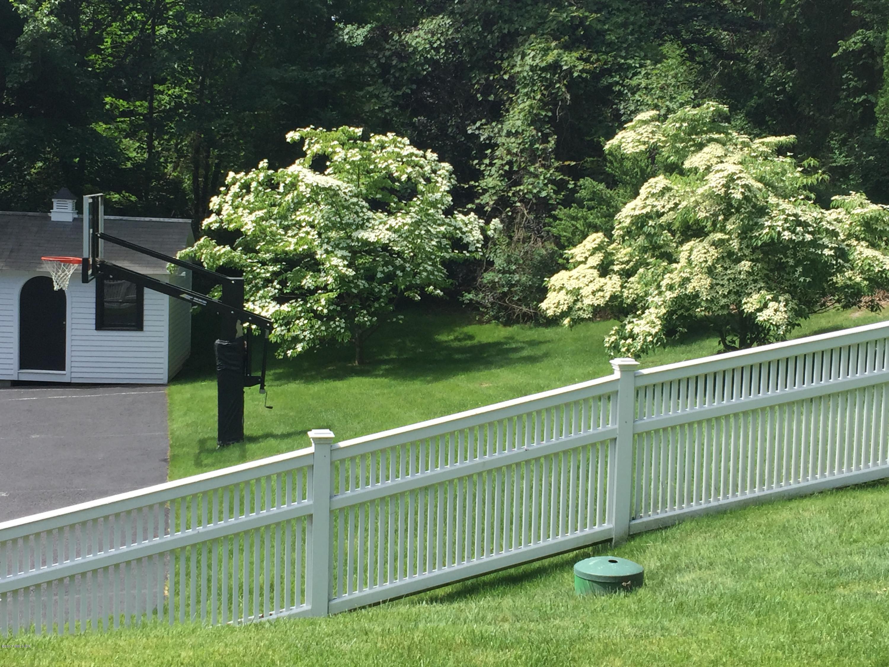 111 Dingletown Road Greenwich, CT 06830 - Photo 36 of 44 a view of a deck and a garden