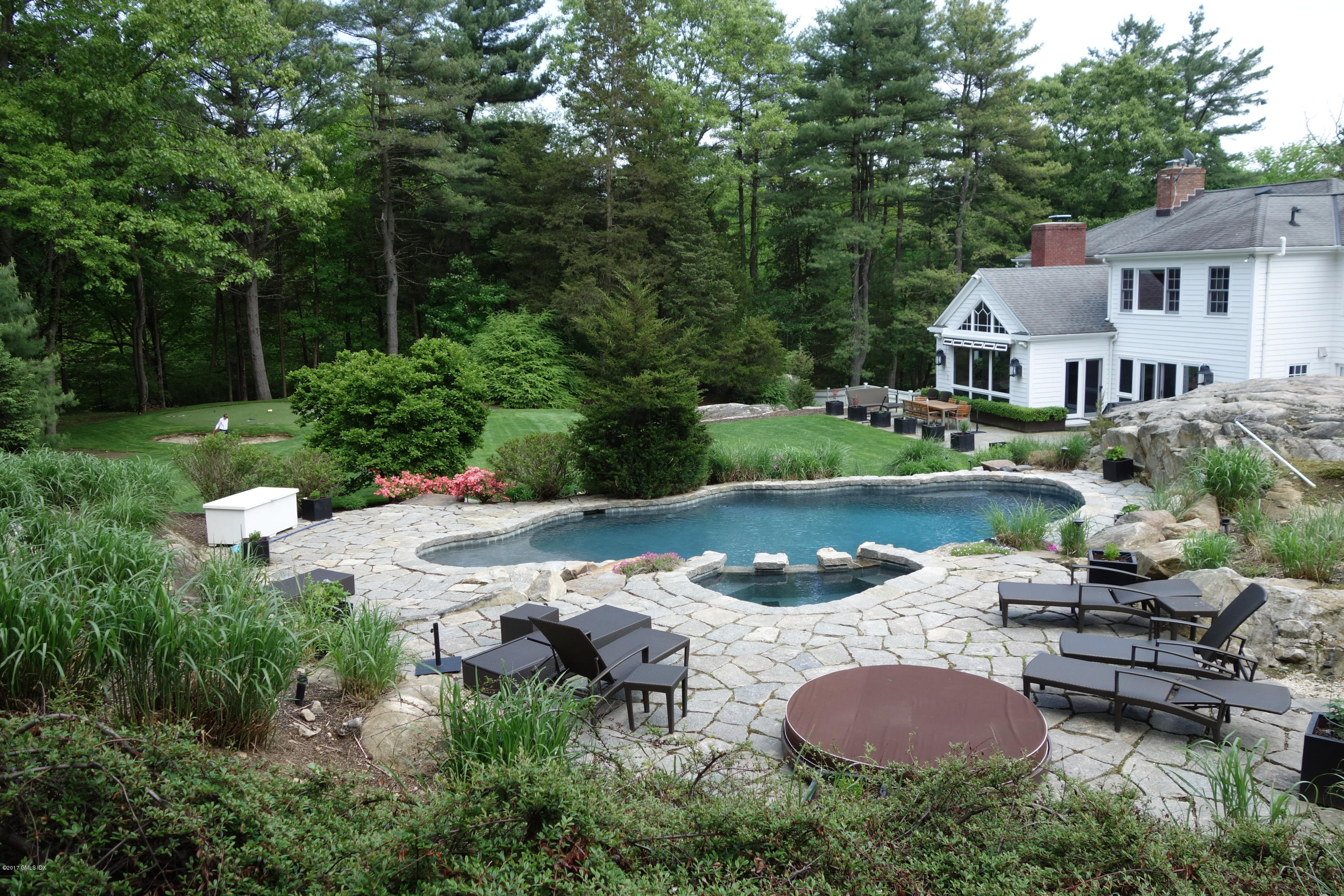 111 Dingletown Road Greenwich, CT 06830 - Photo 39 of 44 an aerial view of a house with garden space and swimming pool