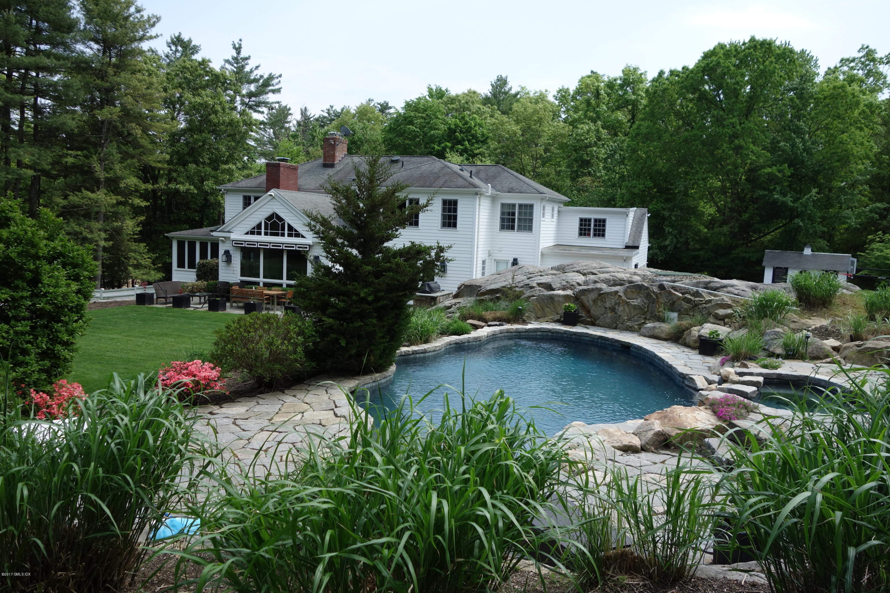 111 Dingletown Road Greenwich, CT 06830 - Photo 40 of 44 a aerial view of a house with swimming pool and garden