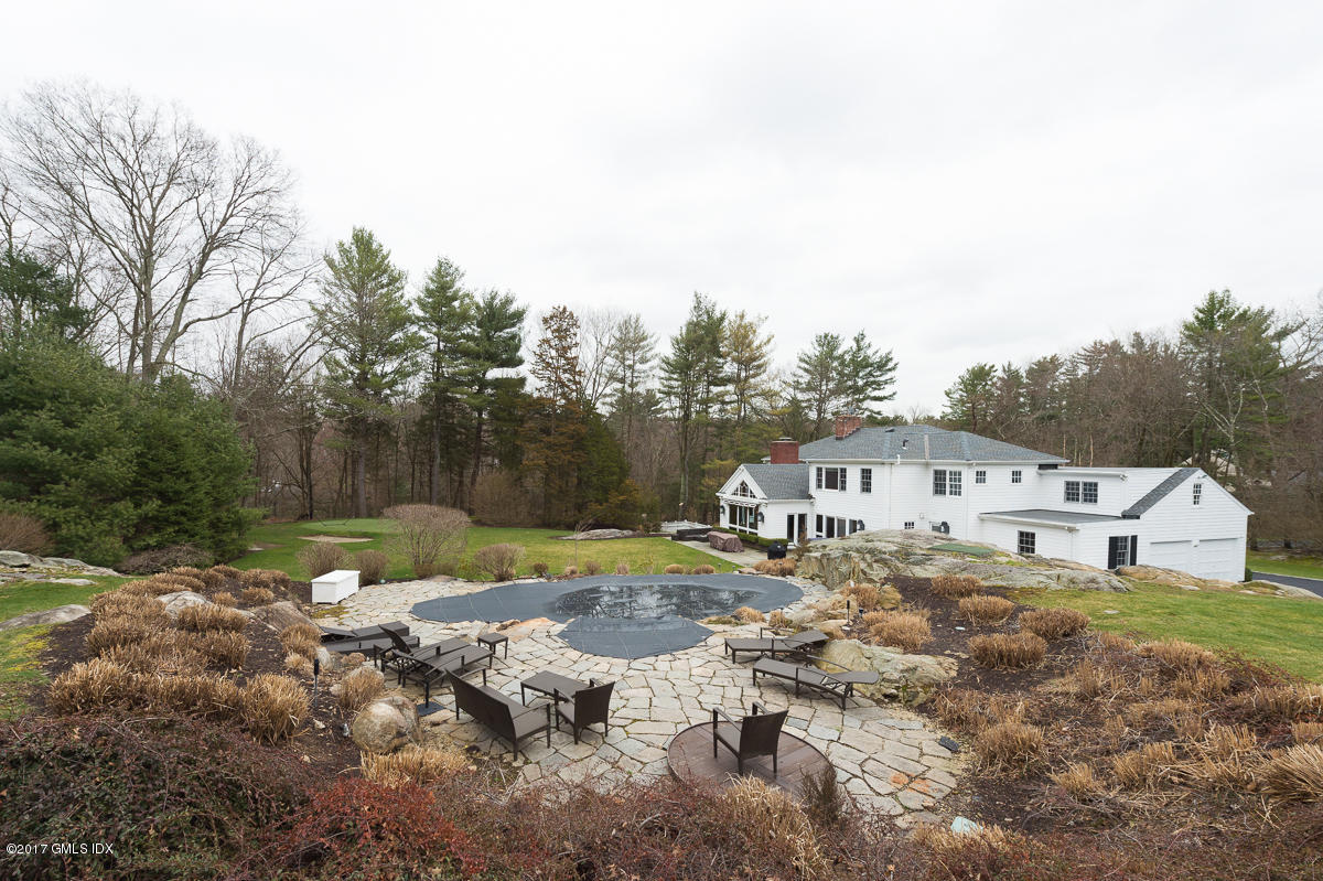 111 Dingletown Road Greenwich, CT 06830 - Photo 41 of 44 a view of a house with a yard and sitting area