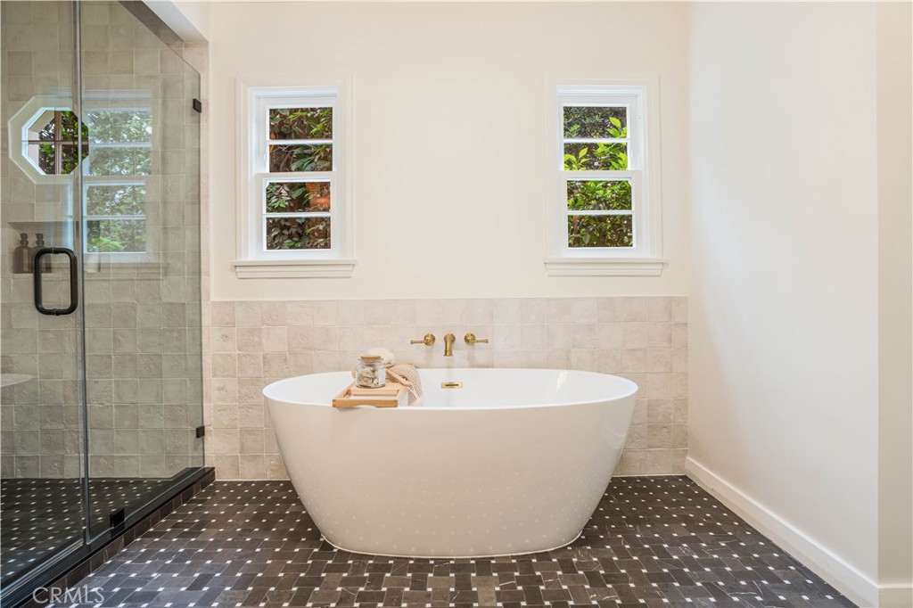 3500 Grayburn Road Pasadena, CA 91107 - Photo 27 of 60 a white bath tub sitting in a bathroom next to a window