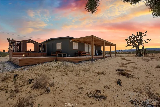 a view of a large house with a yard