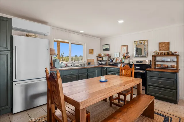 a large kitchen with a table and chairs
