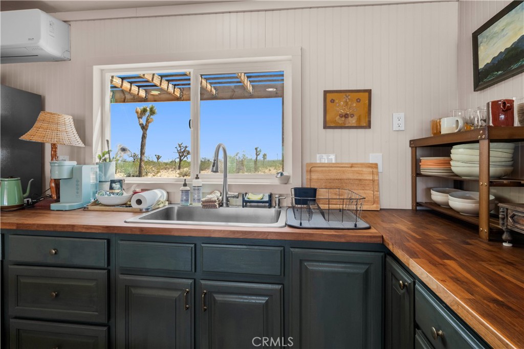 2750 Gibralter Road Landers, CA 92285 - Photo 19 of 56 a kitchen with a sink and cabinets