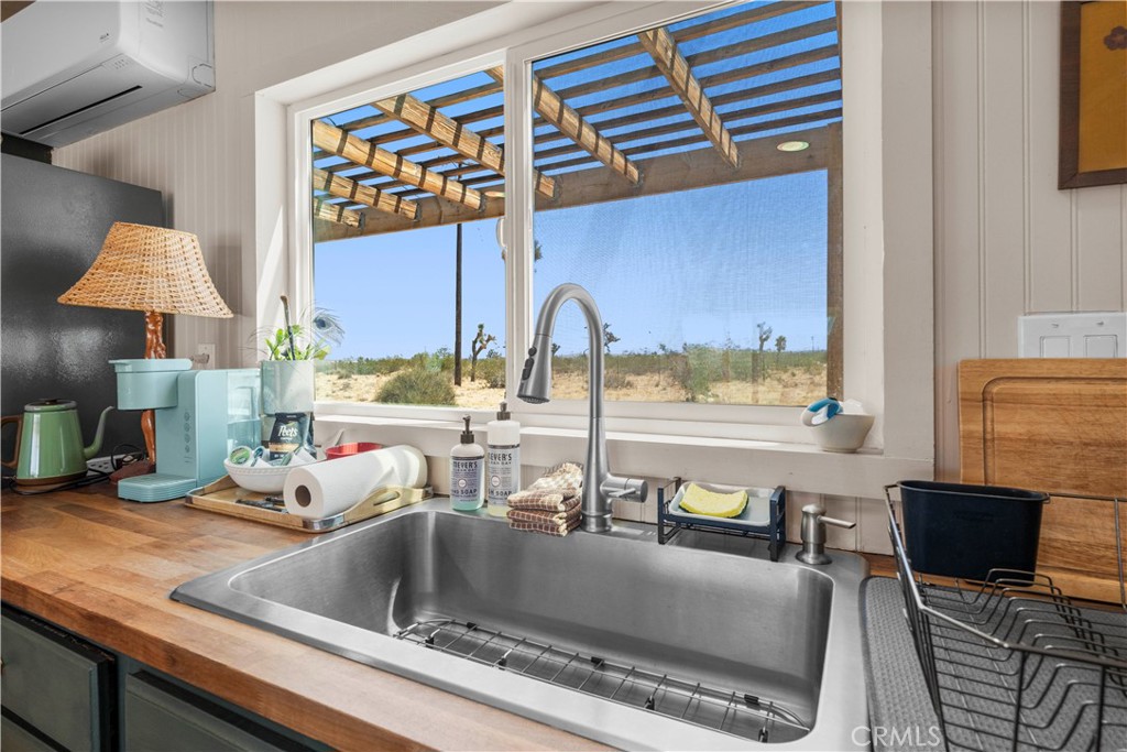 2750 Gibralter Road Landers, CA 92285 - Photo 20 of 56 a kitchen with a sink and a microwave