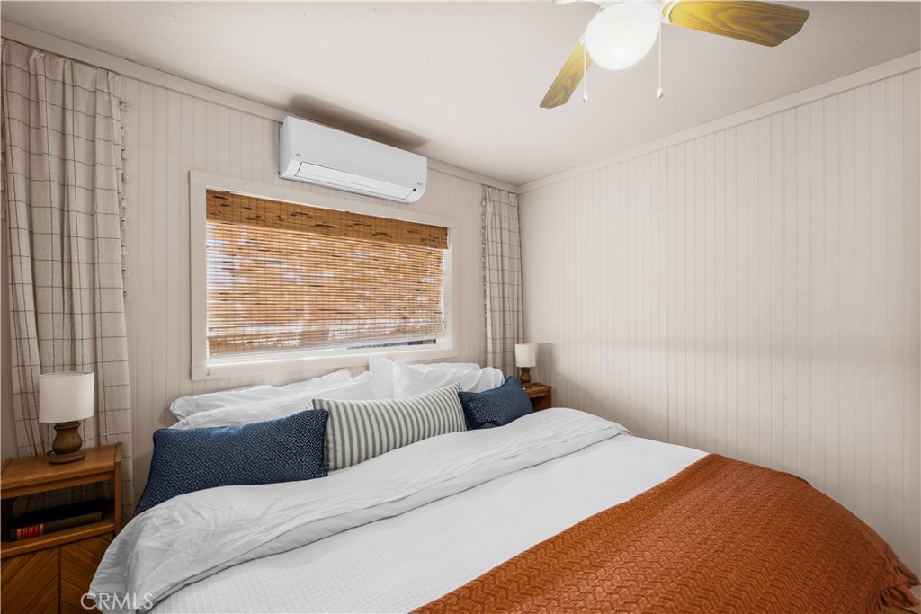 2750 Gibralter Road Landers, CA 92285 - Photo 24 of 56 a bedroom with a bed and a large window