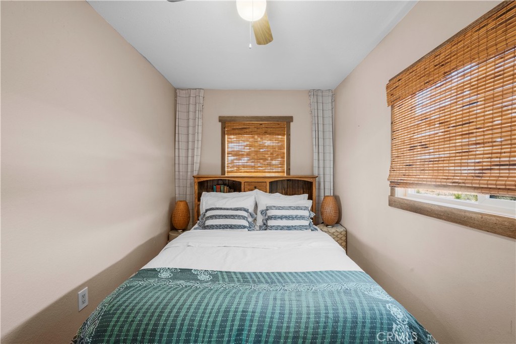 2750 Gibralter Road Landers, CA 92285 - Photo 29 of 56 a bedroom with a large bed and a window