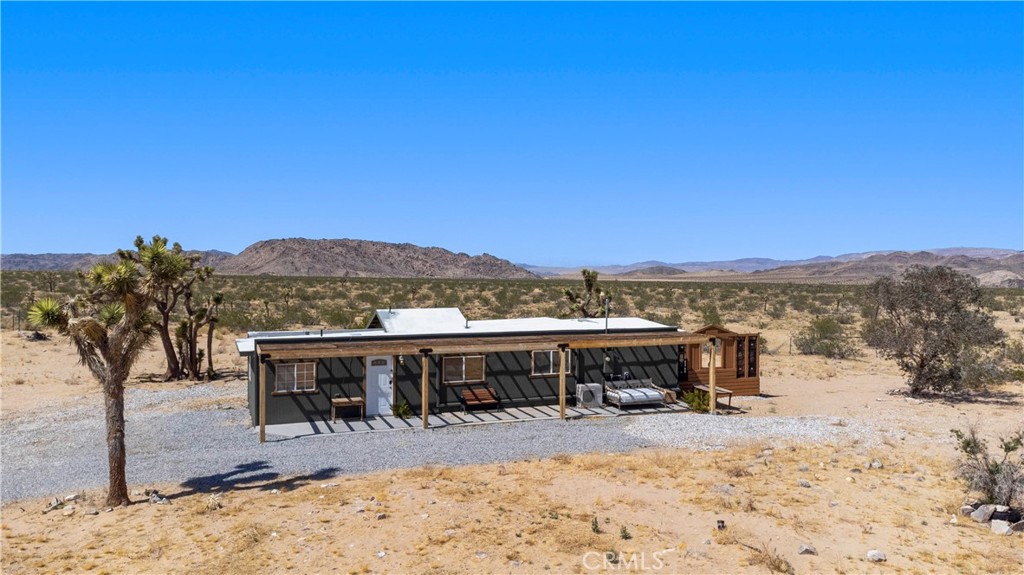 2750 Gibralter Road Landers, CA 92285 - Photo 47 of 56 a view of a house with a yard covered with snow in the outdoor space