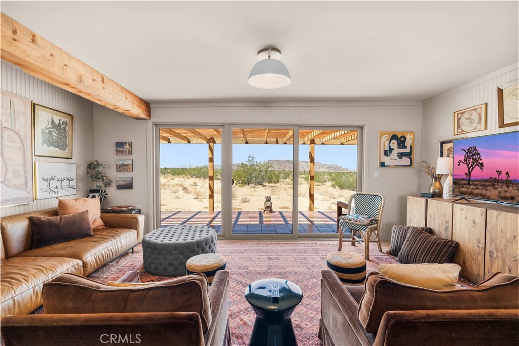 2750 Gibralter Road Landers, CA 92285 - Photo 9 of 56 a living room with furniture and a large window