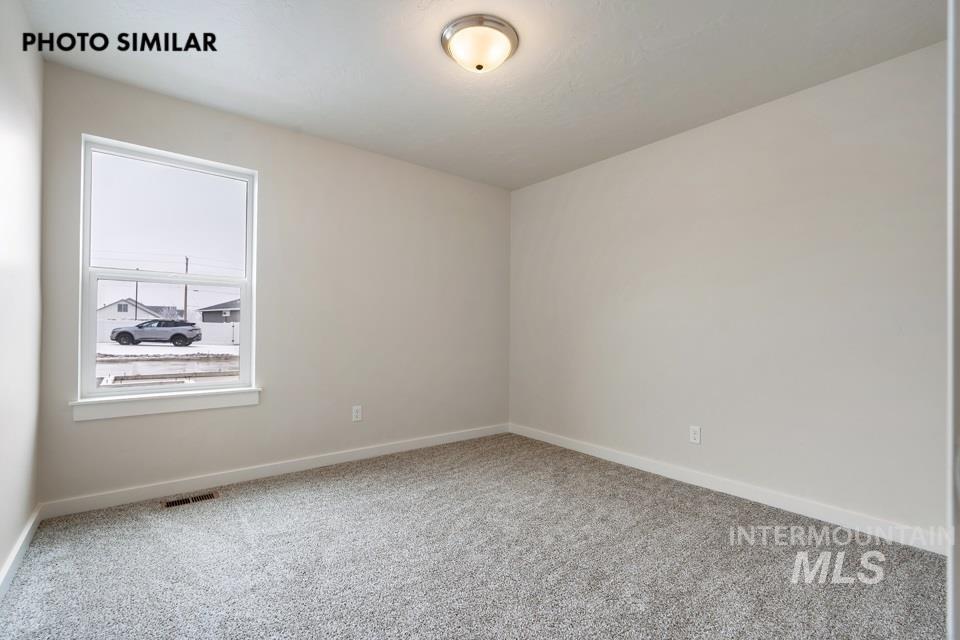 1645 Haystack Emmett, ID 83617 - Photo 25 of 33 Neutral-toned walls complement the grey carpet flooring