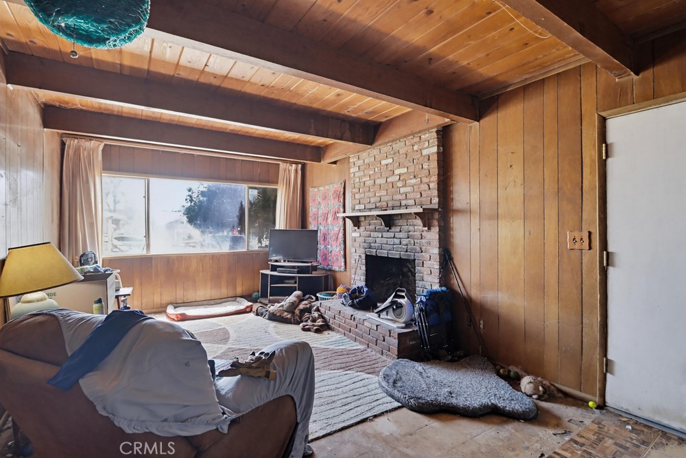 736 Sacramento Avenue Spring Valley, CA 91977 - Photo 4 of 33 a living room with furniture and a fireplace