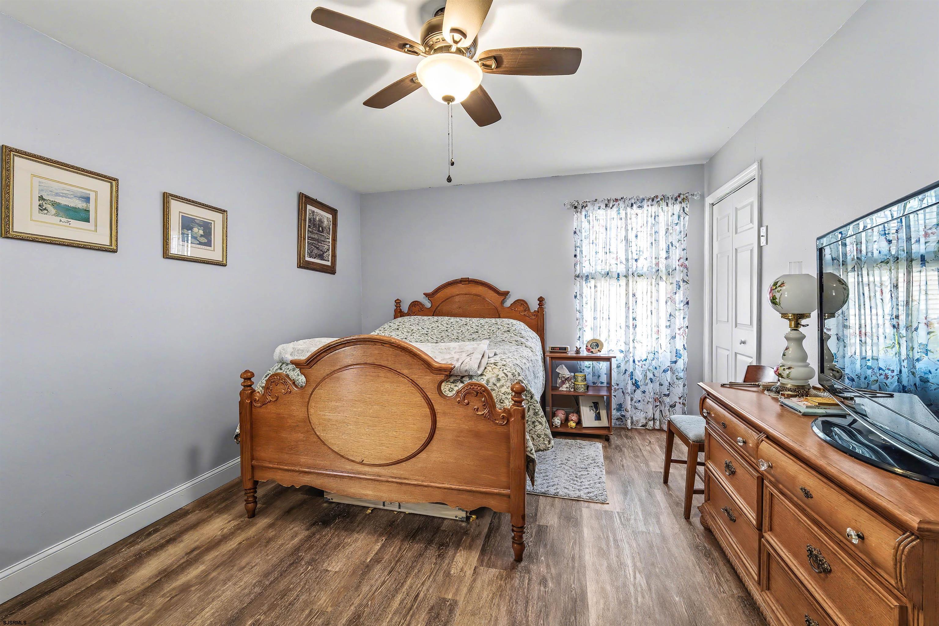 655 Weilers Lane Absecon, NJ 08201 - Photo 11 of 31 a living room with furniture a window and a chandelier