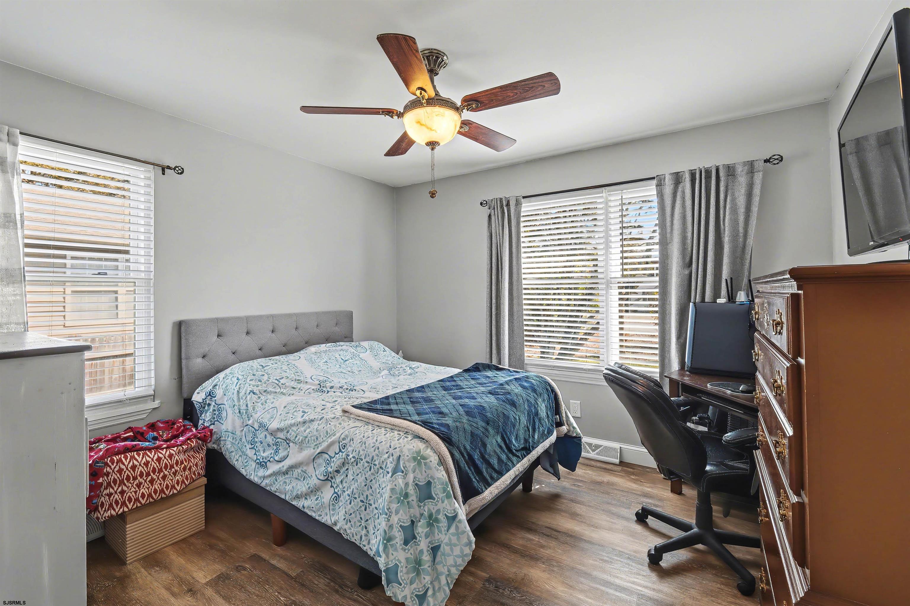 655 Weilers Lane Absecon, NJ 08201 - Photo 14 of 31 a bedroom with a bed and a desk