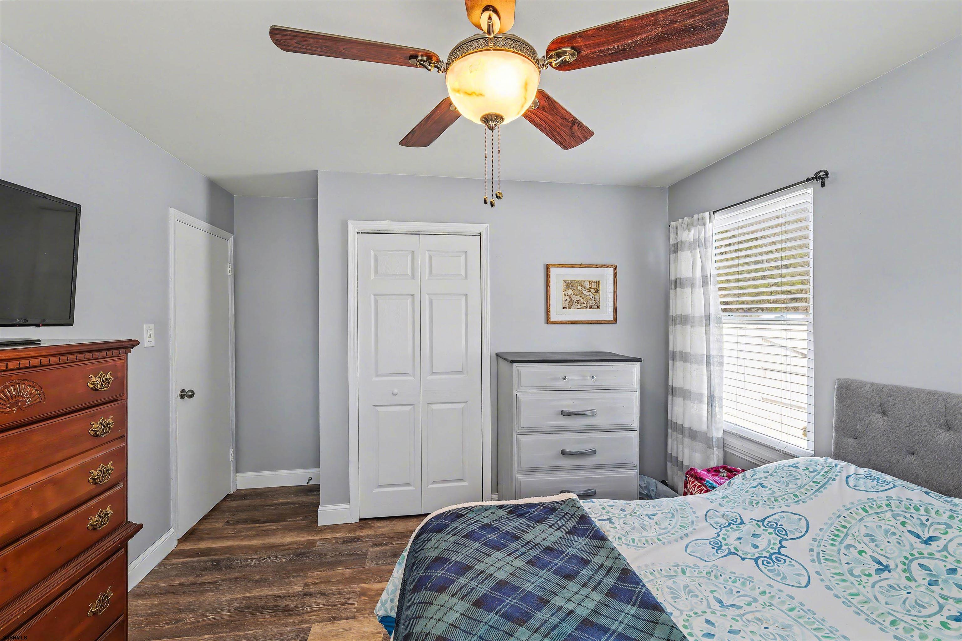 655 Weilers Lane Absecon, NJ 08201 - Photo 15 of 31 a bedroom with a bed and a flat tv screen