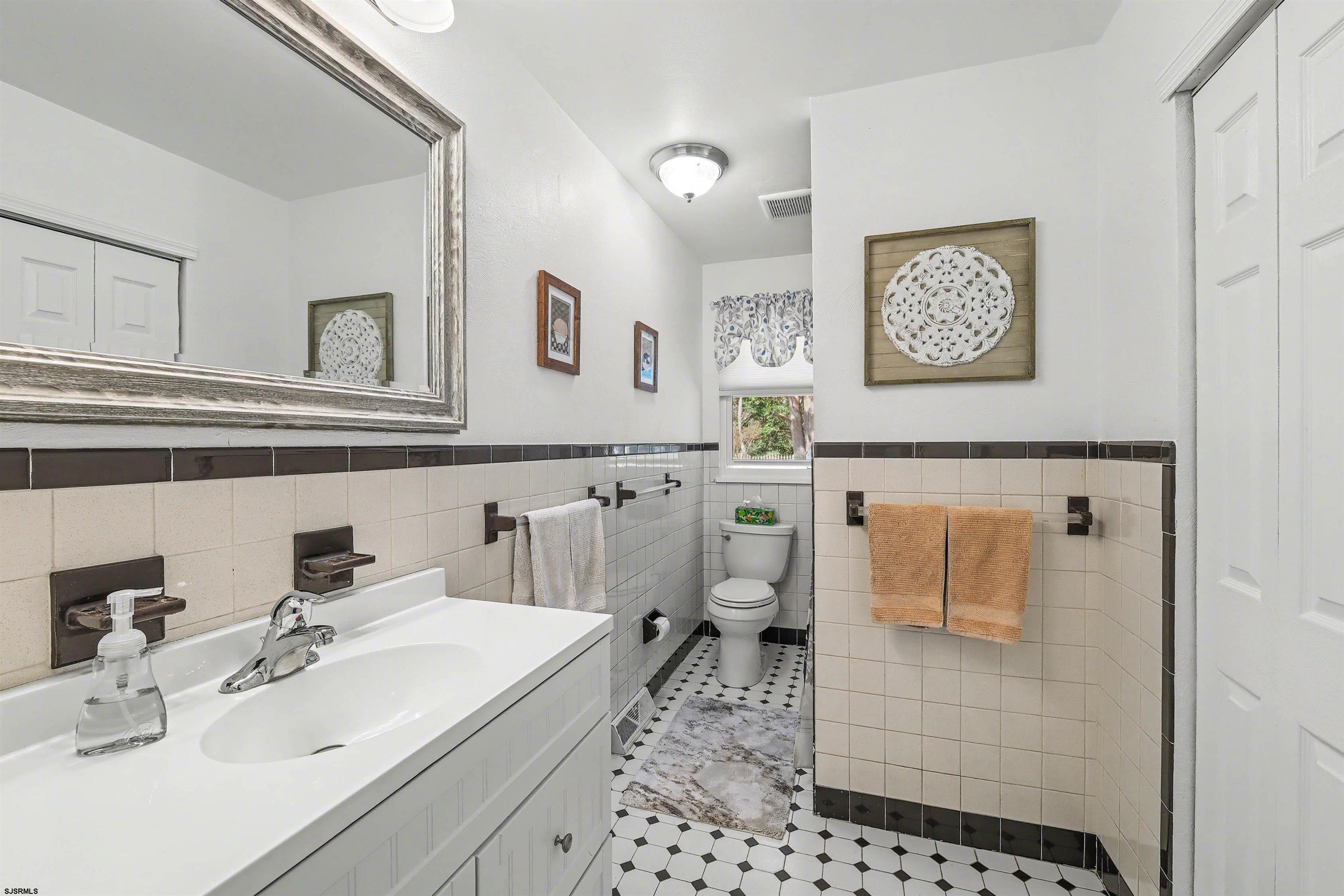 655 Weilers Lane Absecon, NJ 08201 - Photo 18 of 31 a bathroom with a sink toilet and mirror